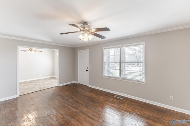 unfurnished room with visible vents, baseboards, ceiling fan, and hardwood / wood-style floors