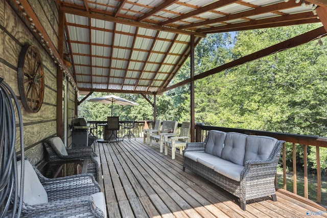 wooden deck with an outdoor living space