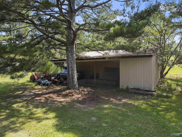 view of property exterior featuring an outbuilding and a lawn