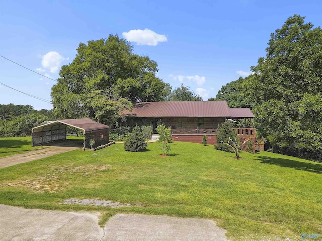 view of front of house with a front lawn and a carport