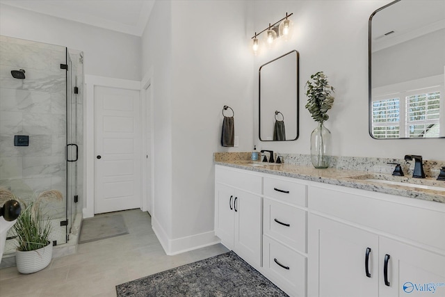 bathroom with ornamental molding, vanity, and a shower with shower door