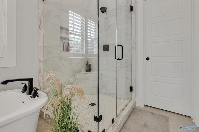 bathroom with independent shower and bath and sink