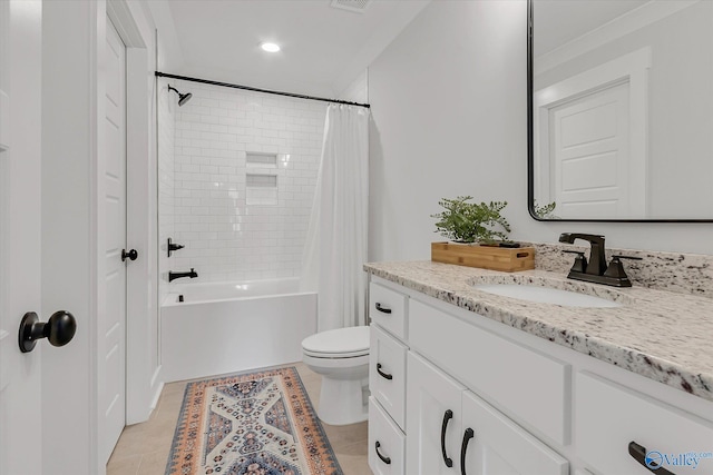 full bathroom featuring vanity, tile patterned floors, shower / bath combination with curtain, and toilet