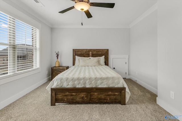 bedroom with ornamental molding, carpet flooring, and ceiling fan