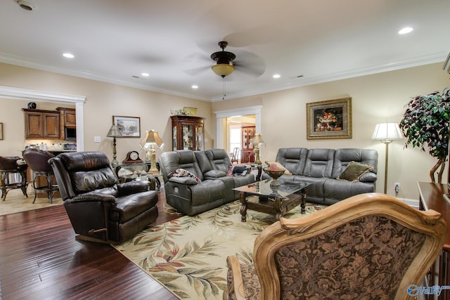 living area featuring dark wood-type flooring, crown molding, recessed lighting, and a ceiling fan
