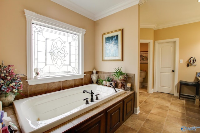 bathroom featuring toilet, crown molding, and a whirlpool tub