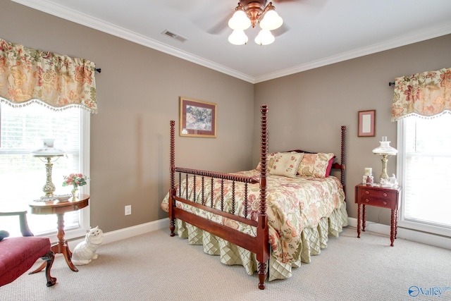 bedroom featuring visible vents, carpet, crown molding, baseboards, and ceiling fan
