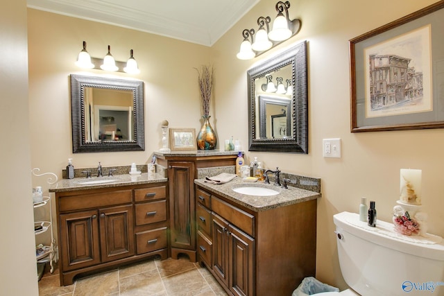 bathroom featuring vanity, crown molding, and toilet