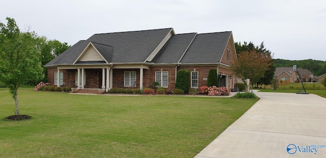 view of front facade with brick siding, a garage, concrete driveway, and a front lawn