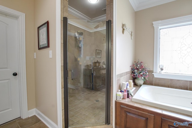 bathroom featuring a shower stall, crown molding, and a garden tub