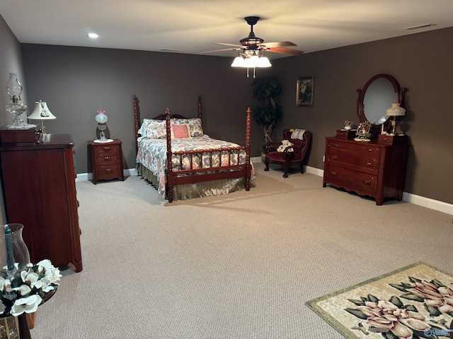 bedroom featuring visible vents, a ceiling fan, baseboards, and carpet floors