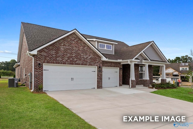 view of front of property with central AC unit and a front yard