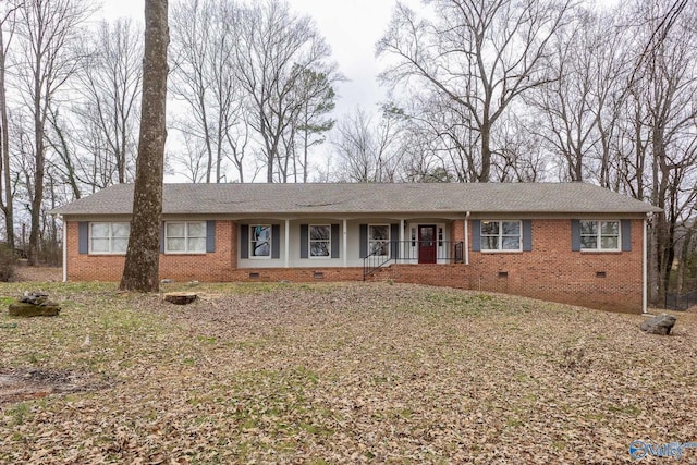 ranch-style house with a porch and a front lawn