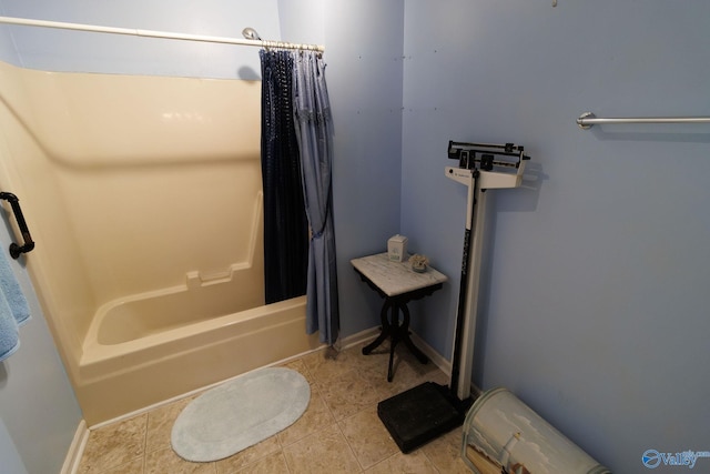 bathroom featuring tile patterned flooring and shower / tub combo