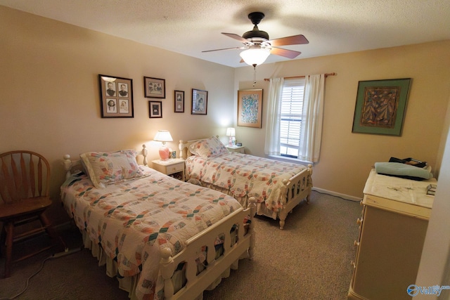 bedroom featuring ceiling fan, carpet, and a textured ceiling