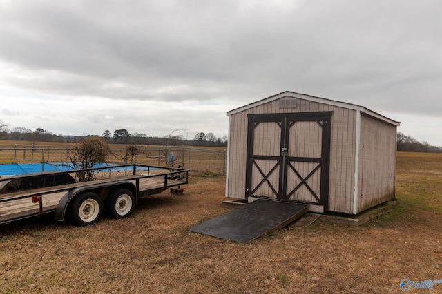 view of outdoor structure featuring a yard