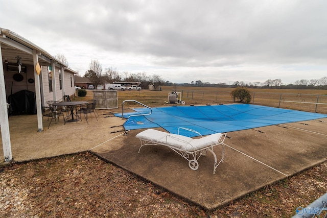 view of swimming pool featuring area for grilling and a patio area