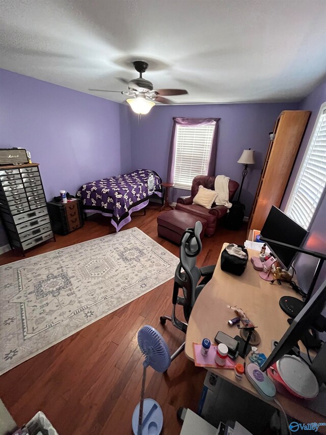 bedroom featuring hardwood / wood-style floors and ceiling fan