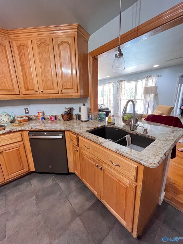 kitchen featuring light stone counters, pendant lighting, sink, kitchen peninsula, and stainless steel dishwasher