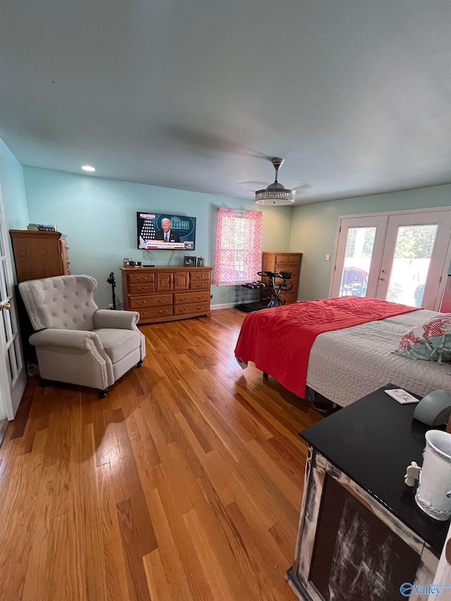 bedroom with ceiling fan and light hardwood / wood-style flooring