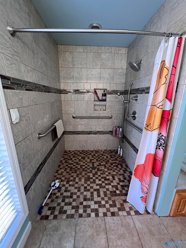 bathroom featuring tile patterned flooring and walk in shower