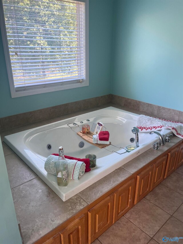 bathroom featuring a bathing tub and tile patterned flooring