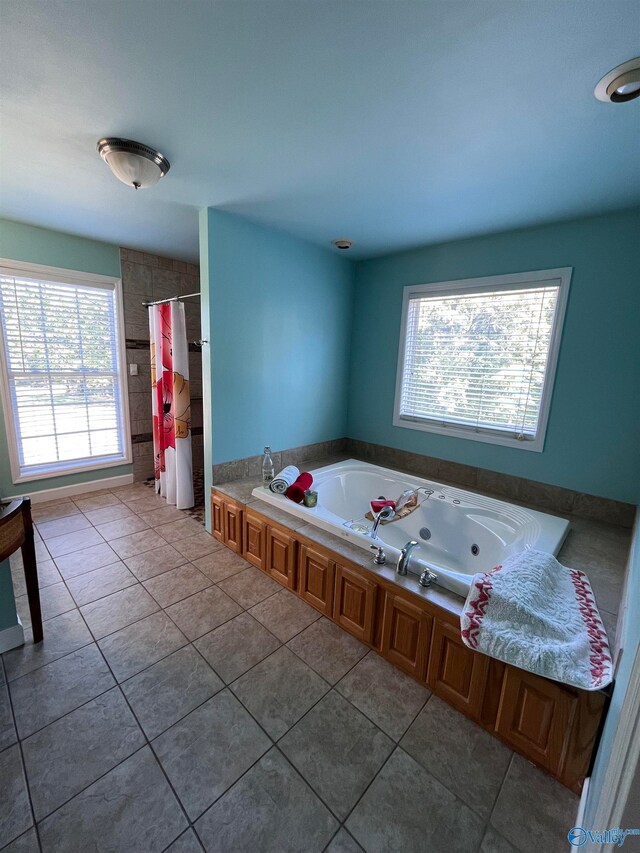 bathroom featuring tile patterned flooring and plus walk in shower