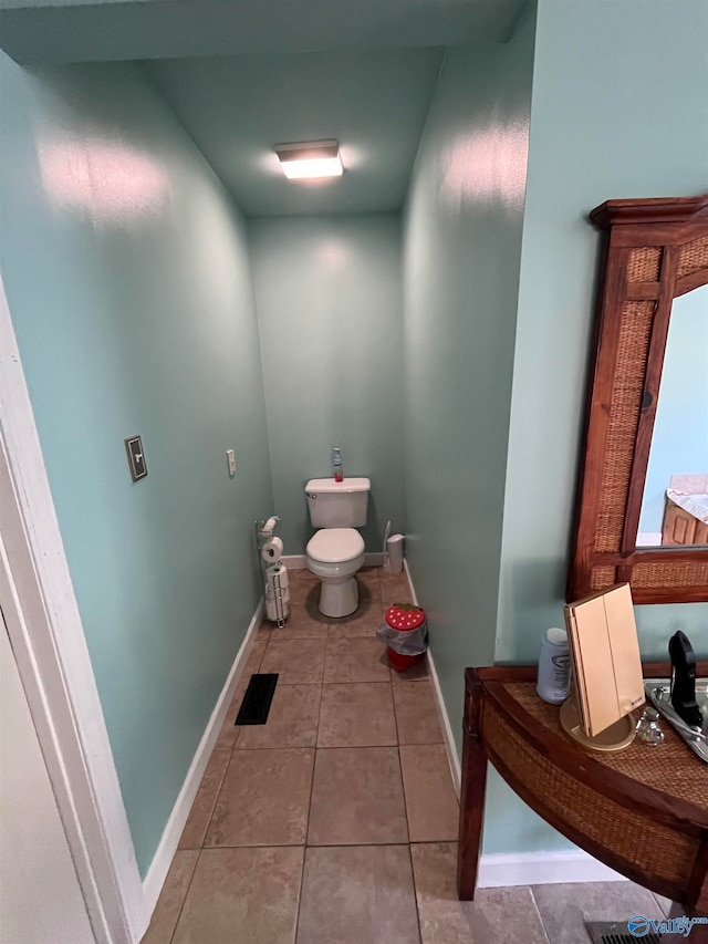 bathroom with tile patterned flooring and toilet