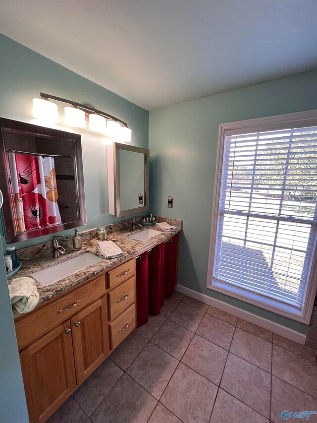 bathroom with vanity and tile patterned flooring