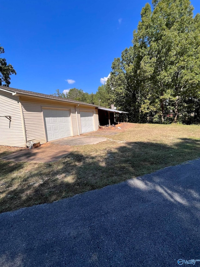 garage with a lawn