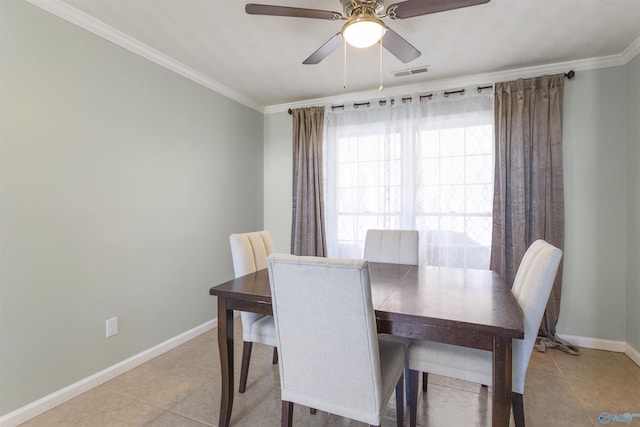 dining area featuring light tile patterned floors, baseboards, visible vents, and ornamental molding