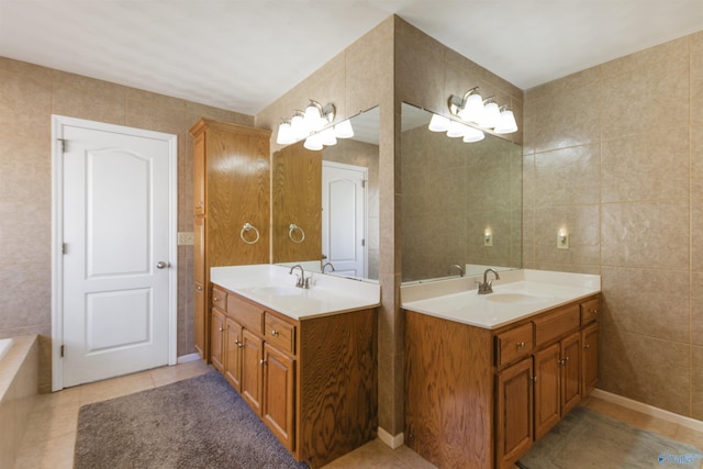 bathroom featuring a sink, two vanities, and tile walls