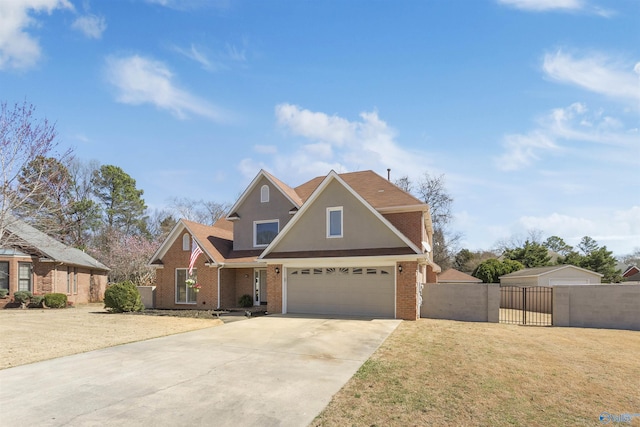 traditional-style house featuring brick siding, fence, a front yard, driveway, and a gate