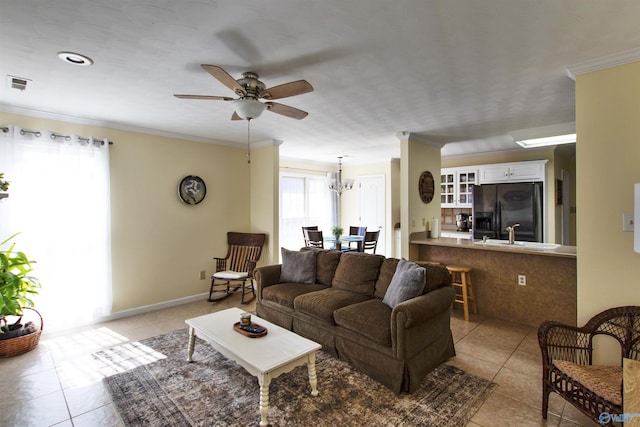 living room featuring light tile patterned floors, visible vents, and ornamental molding