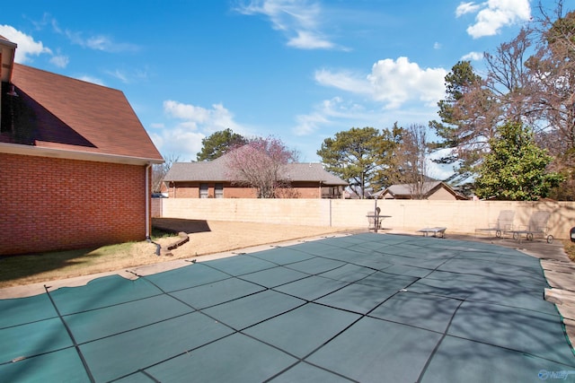 view of swimming pool featuring a patio area and a fenced backyard