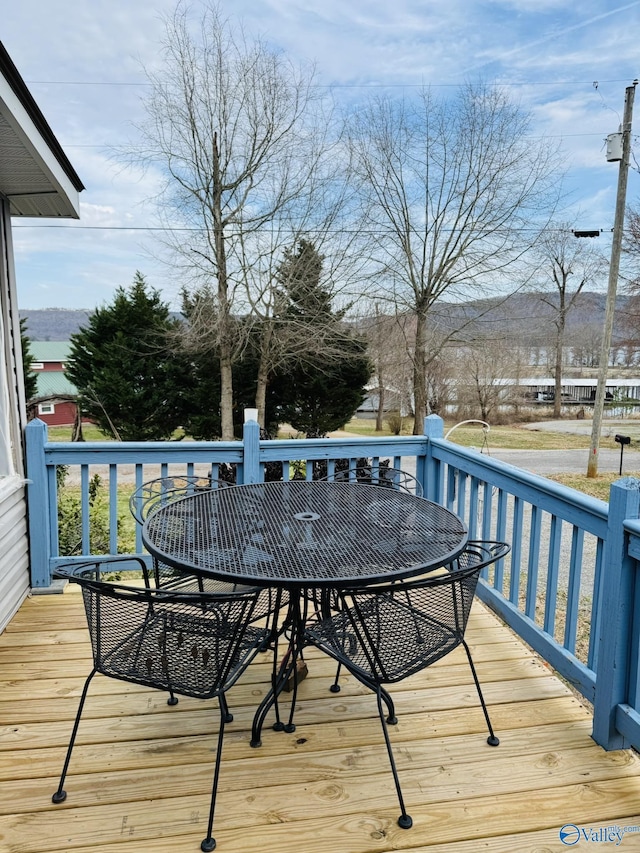 deck featuring outdoor dining area