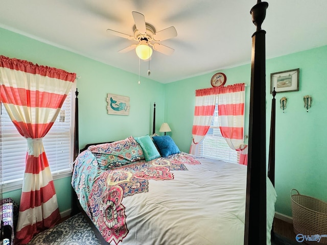 bedroom with baseboards and a ceiling fan