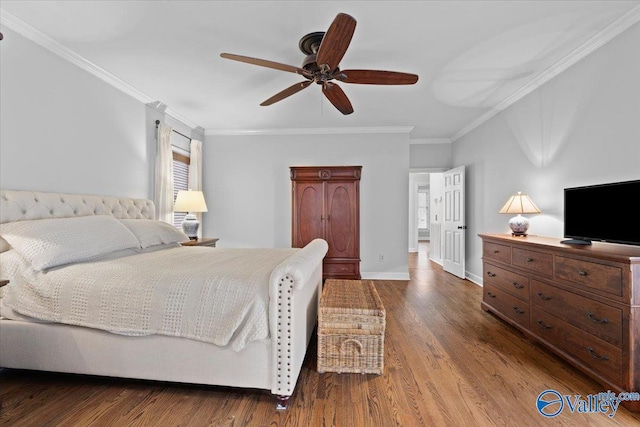 bedroom featuring ceiling fan, ornamental molding, wood finished floors, and baseboards