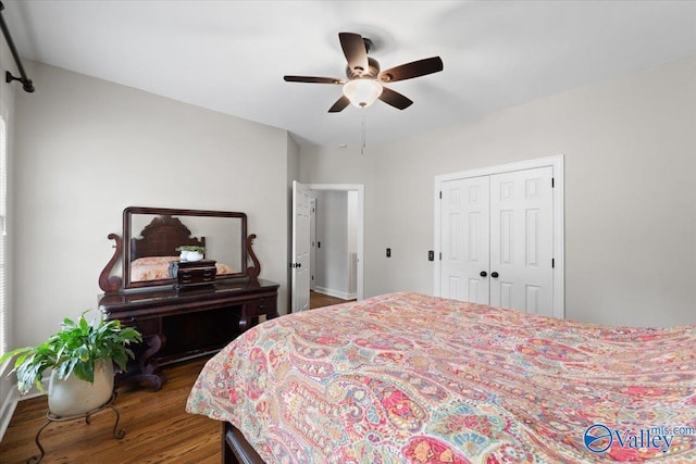 bedroom with a closet, ceiling fan, and wood finished floors