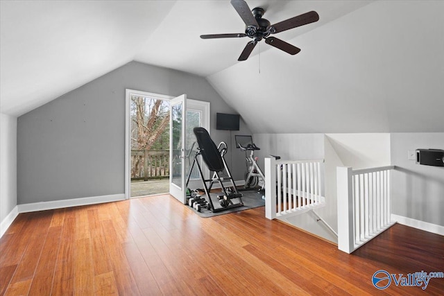 bonus room with baseboards, vaulted ceiling, and hardwood / wood-style floors