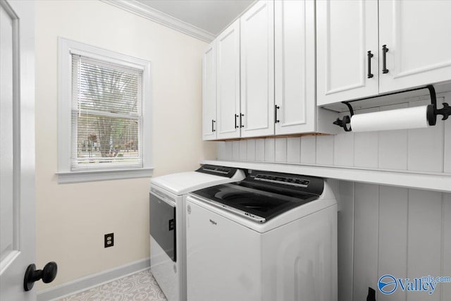 laundry room featuring cabinet space, baseboards, ornamental molding, and separate washer and dryer