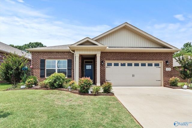 14930 Eva Cir, Athens, AL 35613 - view of front of house with brick siding, an attached garage, a front yard, concrete driveway, and board and batten siding