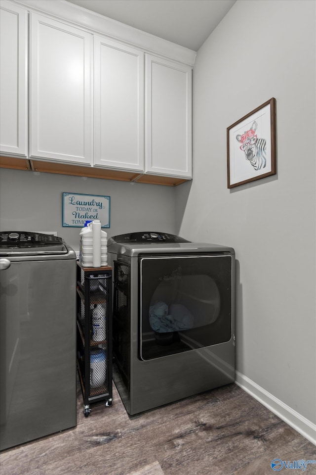14930 Eva Cir, Athens, AL 35613 - laundry room with washing machine and dryer, cabinet space, and wood finished floors