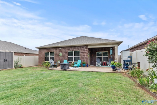 14930 Eva Cir, Athens, AL 35613 - back of house featuring a patio area, a fenced backyard, brick siding, and a storage shed