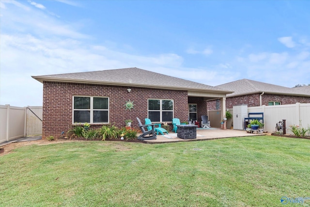 14930 Eva Cir, Athens, AL 35613 - rear view of property featuring brick siding, a patio area, and a fenced backyard
