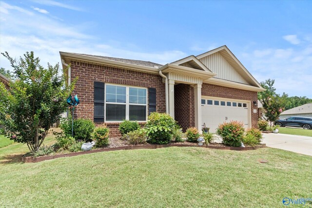 14930 Eva Cir, Athens, AL 35613 - ranch-style house featuring brick siding, driveway, an attached garage, and a front yard