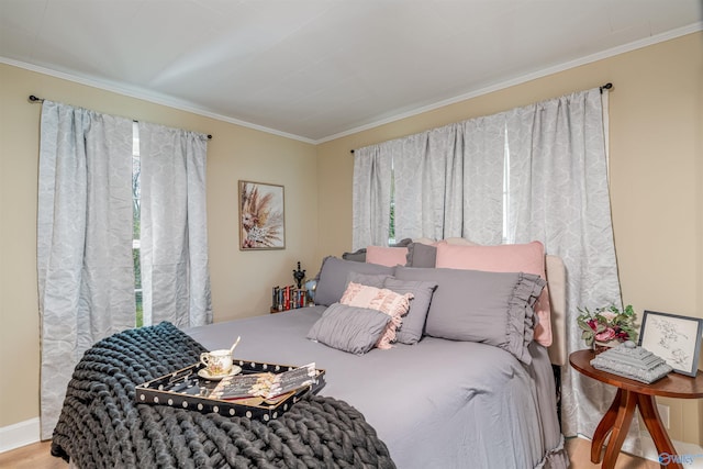 bedroom featuring hardwood / wood-style floors and ornamental molding