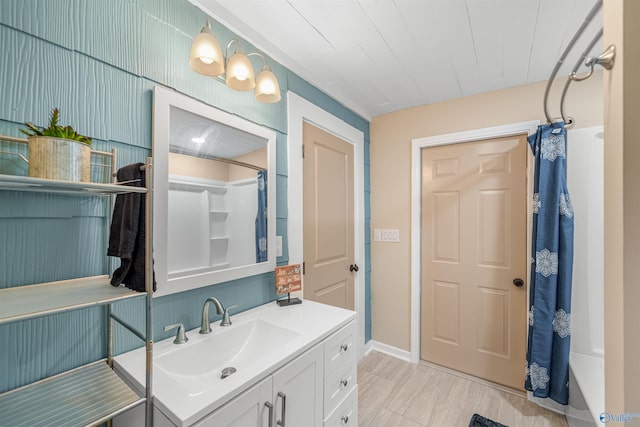 bathroom with vanity and shower / tub combo with curtain