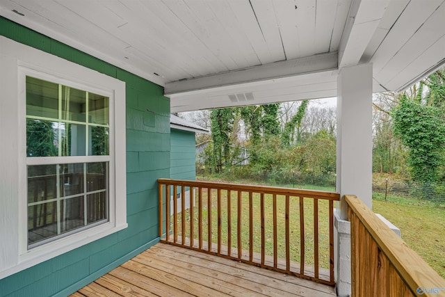 wooden deck with a yard