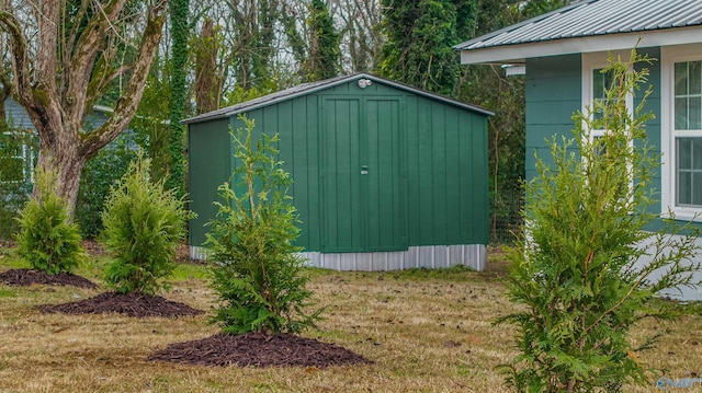 view of outbuilding featuring a yard